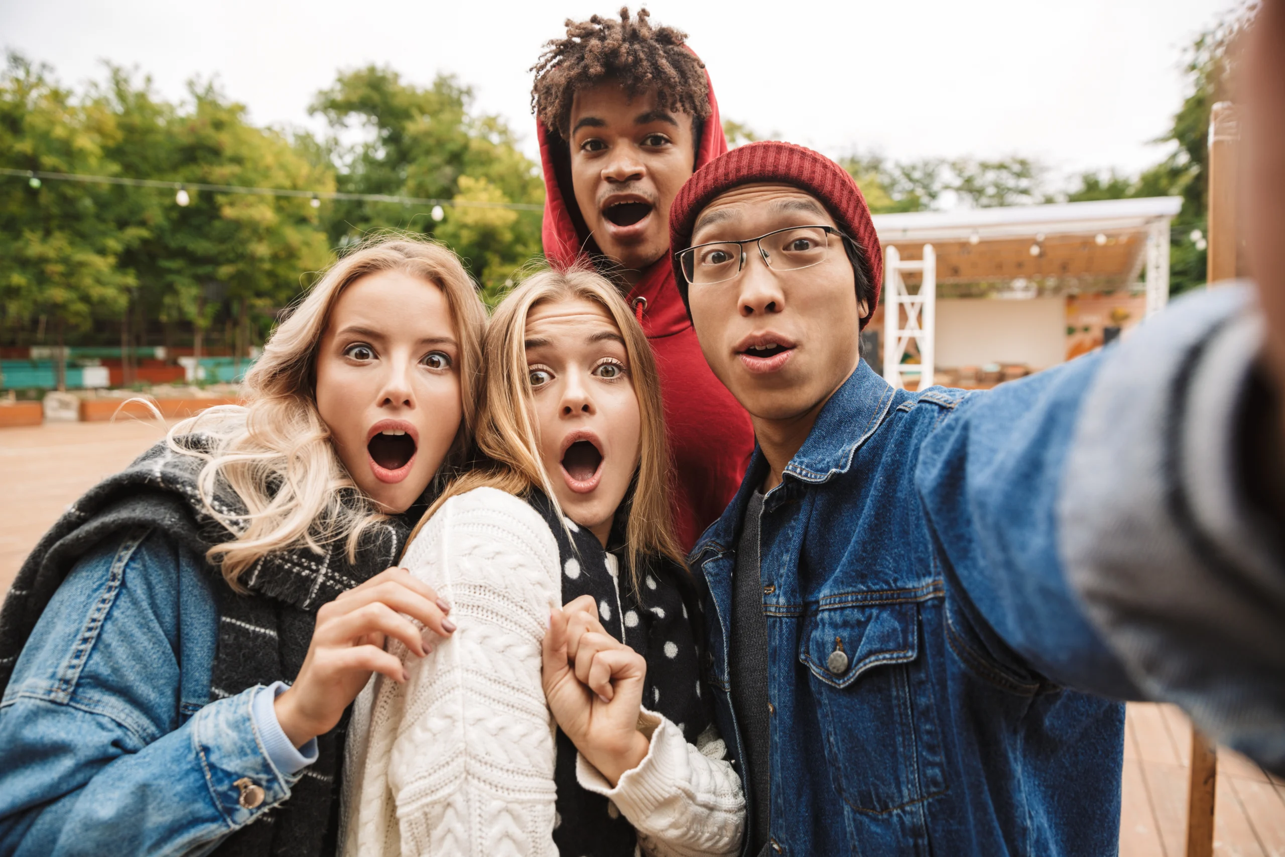 Group if cheerful multiethnic friends teenagers